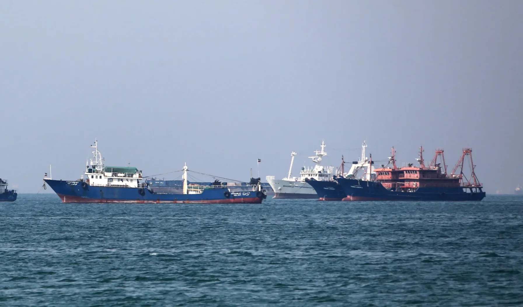 Cargo and fishing vessels anchored near the Iranian coast in the Persian Gulf