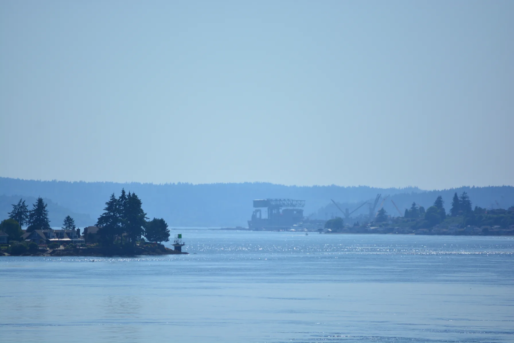 Sinclair Inlet as seen from the Bremerton waterfront, the Puget Sound inlet where Kitsap County and DNR removed 27 derelict boats and two vessels sank and spilled oil in 2025