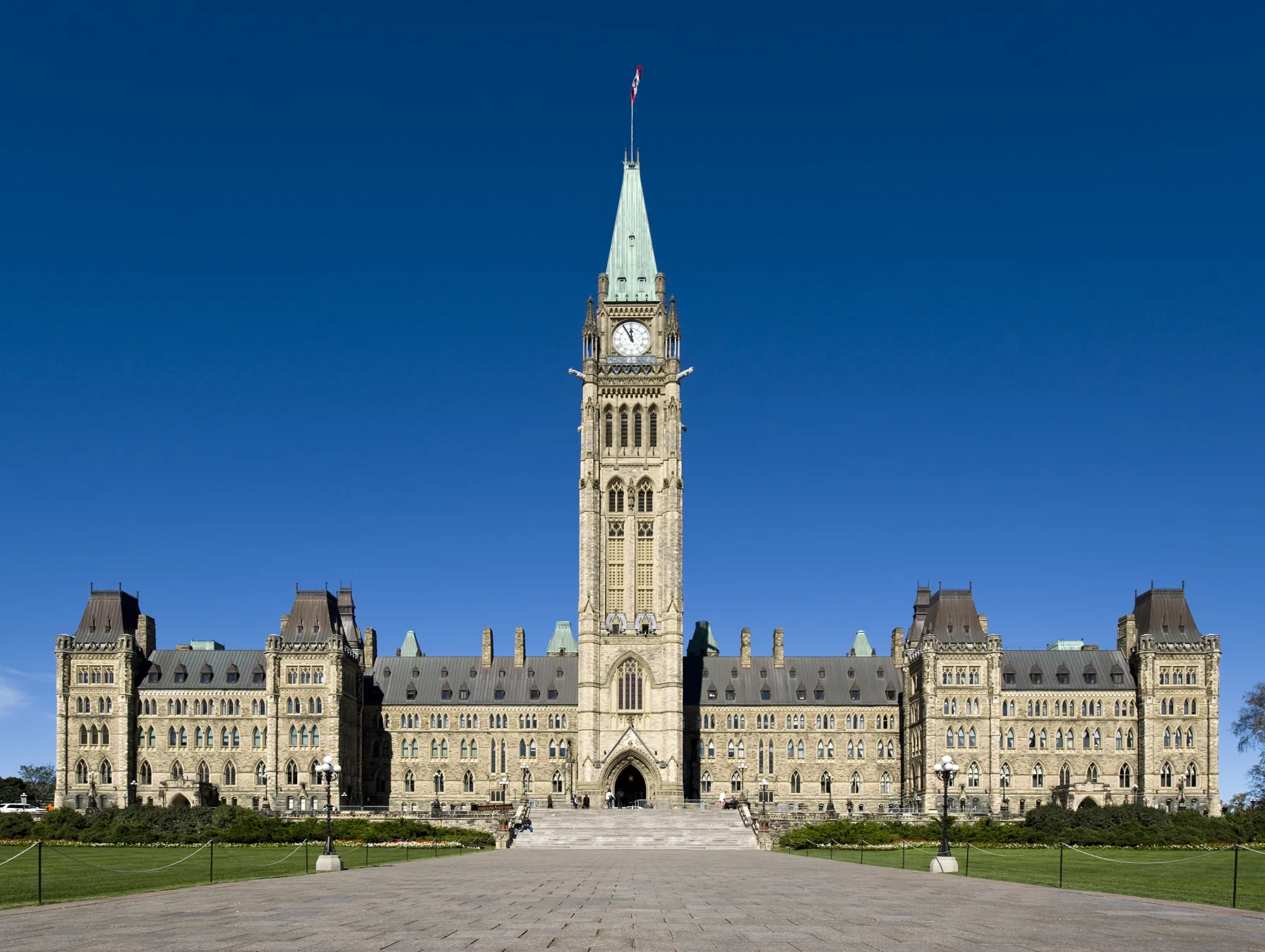 Centre Block and the Peace Tower on Parliament Hill in Ottawa, Canada, under a clear blue sky