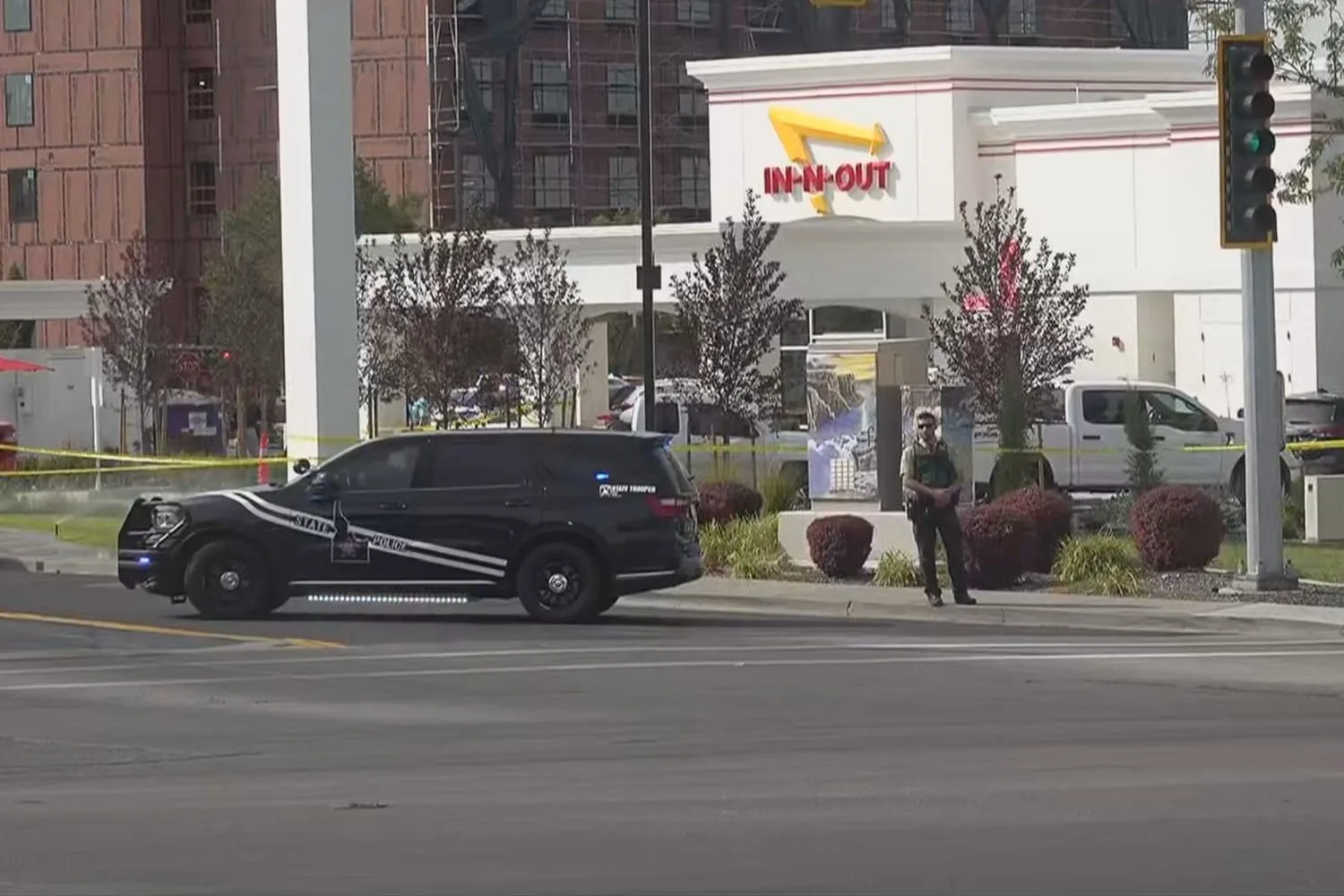 Twin Falls police and fire vehicles blocking the street outside an In-N-Out Burger restaurant after a shooting