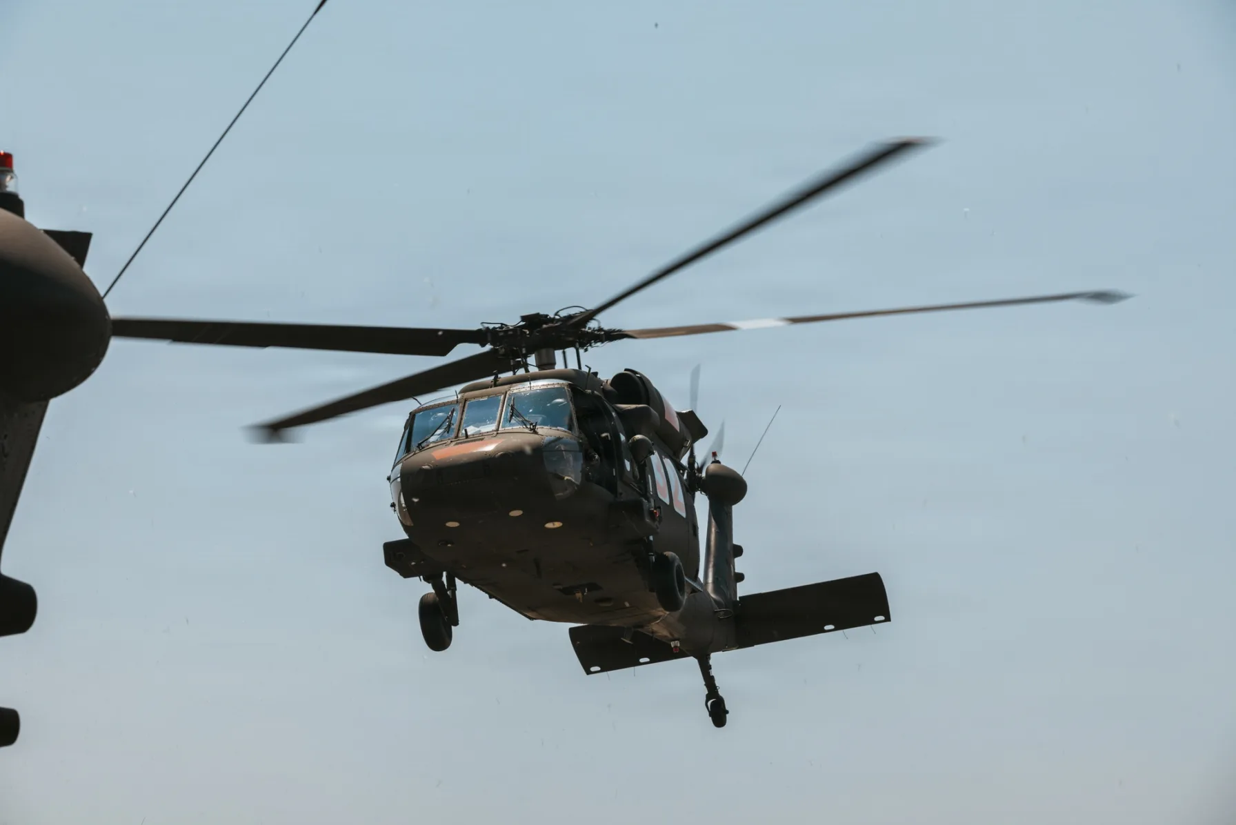 A Washington Army National Guard UH-60 Black Hawk helicopter in flight supporting wildfire response operations